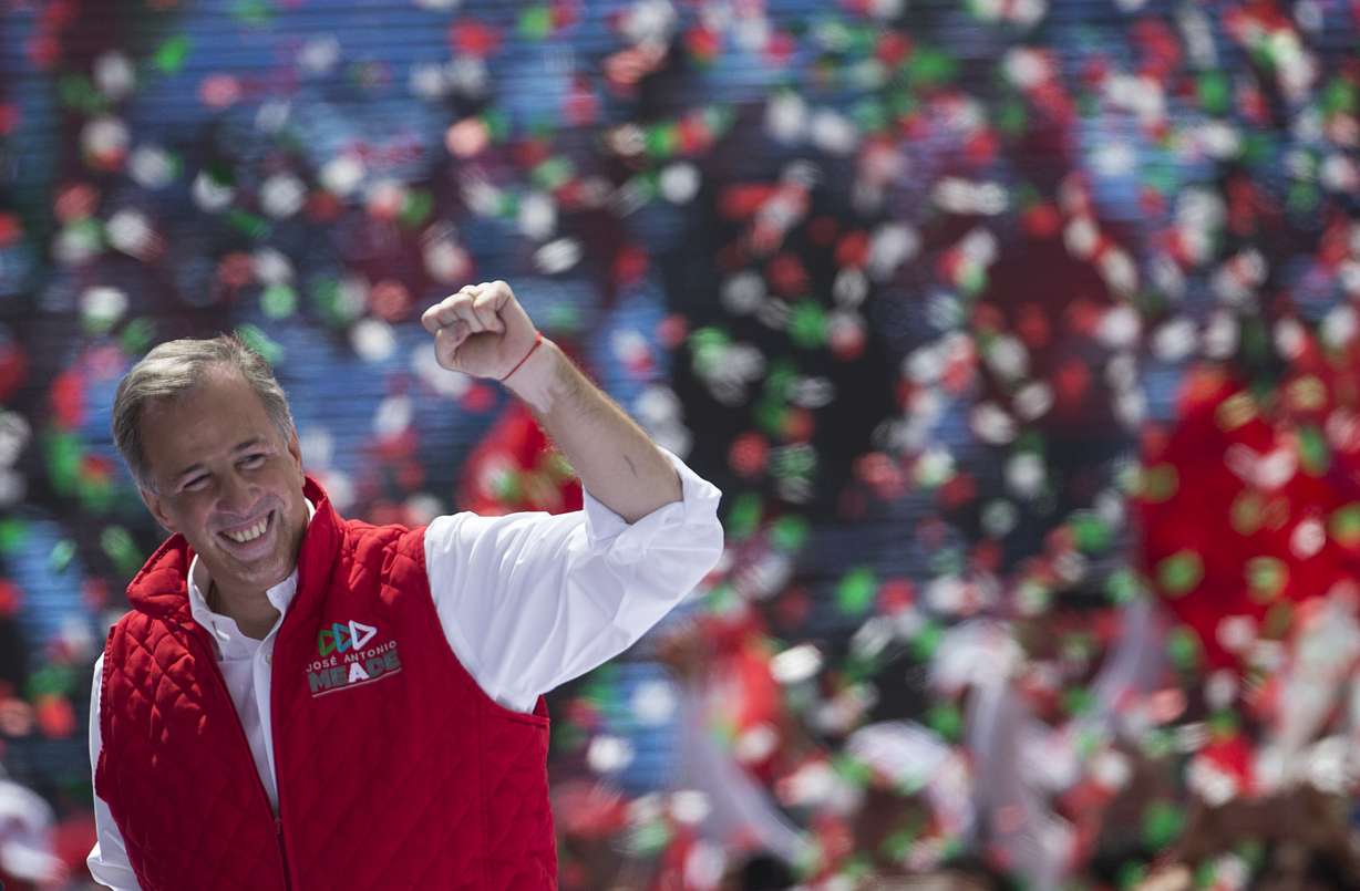 Presidential candidate Jose Antonio Meade, of the Institutional Revolutionary Party, PRI, gestures to supporters at the end of his campaign rally in Toluca, Mexico, Sunday, June 24, 2018. Mexico's four presidential candidates are holding their last weekend of campaigning before the country's July 1 elections. (AP Photo/Moises Castillo)