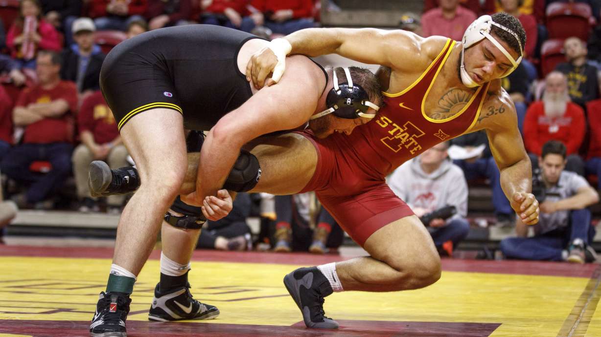 Police charge Iowa wrestler with lying about shooting