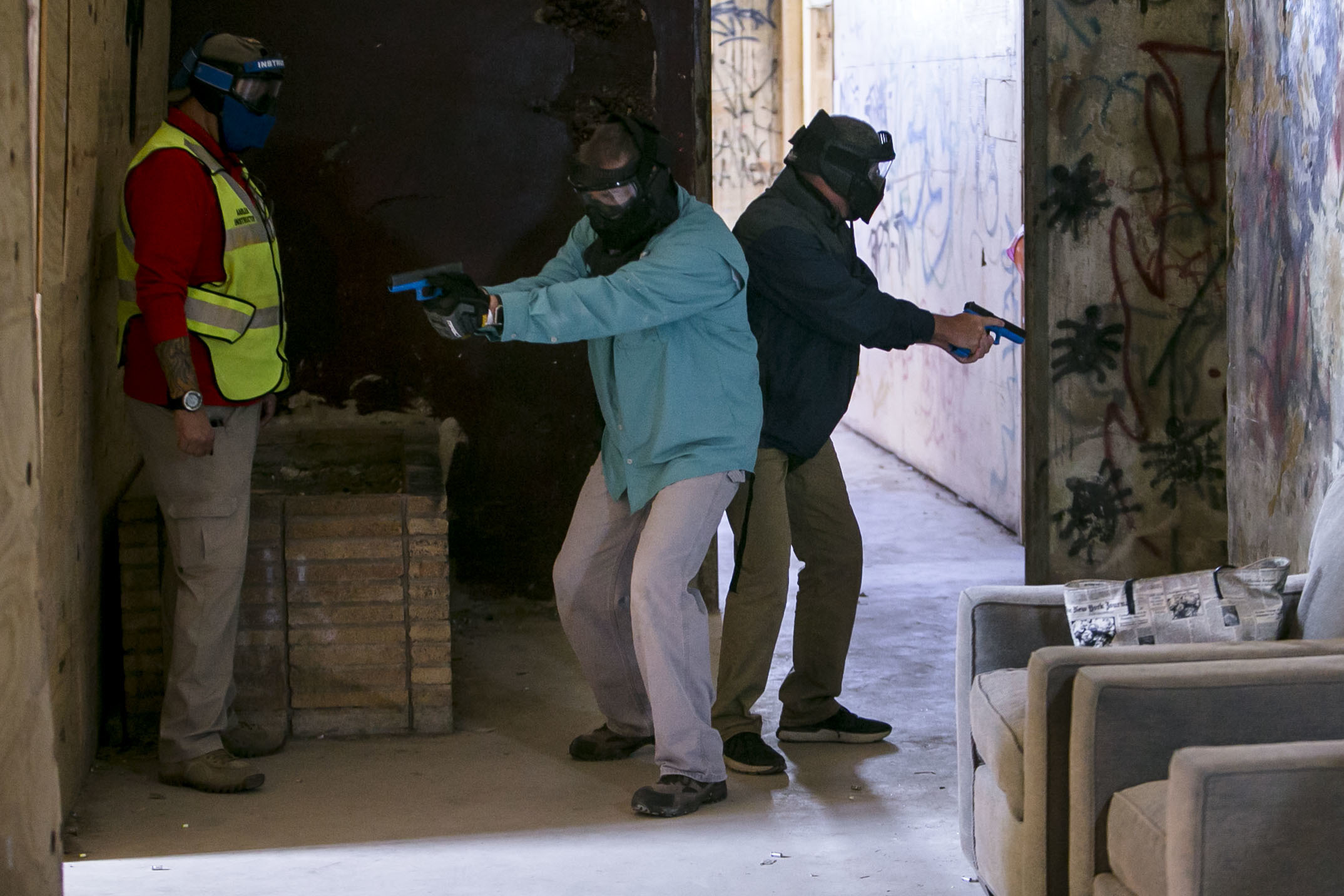 Area school employees participate in a simulation during school marshal training at at Bexar County Firearms Training Center on Friday, June 29, 2018 in San Antonio, Texas. The School Marshal Program, which essentially deputizes teachers and other staff members, trains school staff members to carry a concealed weapon and how to respond to an active shooter situation. (Josie Norris /The San Antonio Express-News via AP)
