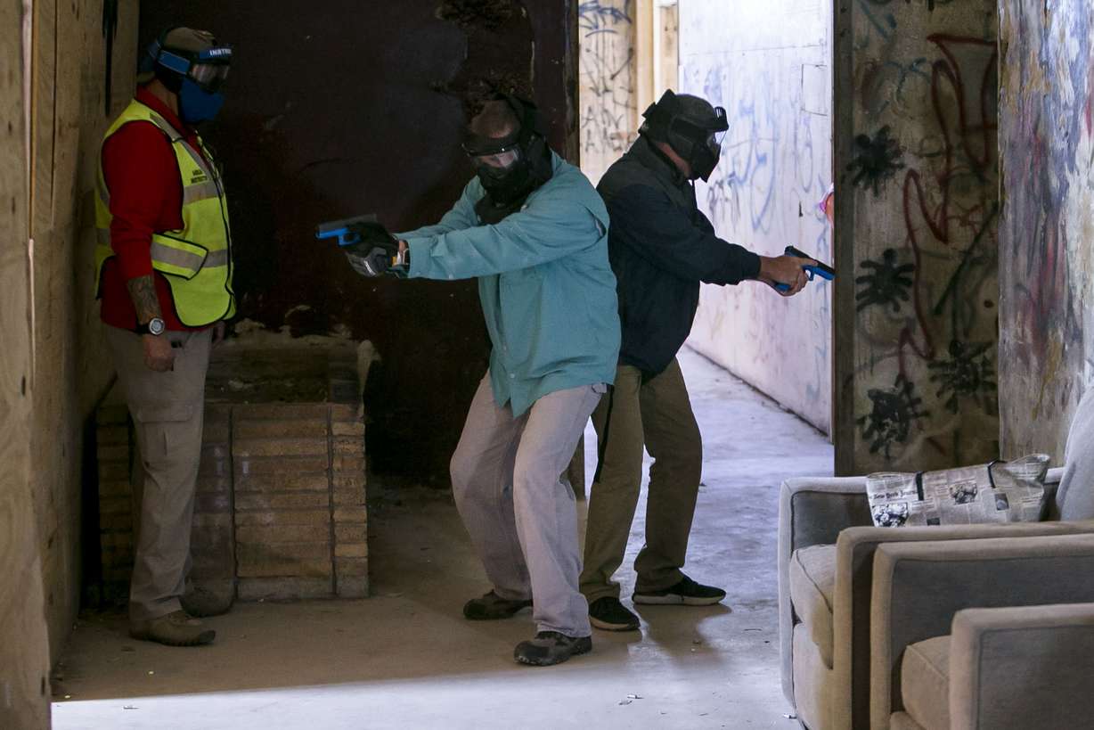 Area school employees participate in a simulation during school marshal training at at Bexar County Firearms Training Center on Friday, June 29, 2018 in San Antonio, Texas. The School Marshal Program, which essentially deputizes teachers and other staff members, trains school staff members to carry a concealed weapon and how to respond to an active shooter situation. (Josie Norris /The San Antonio Express-News via AP)