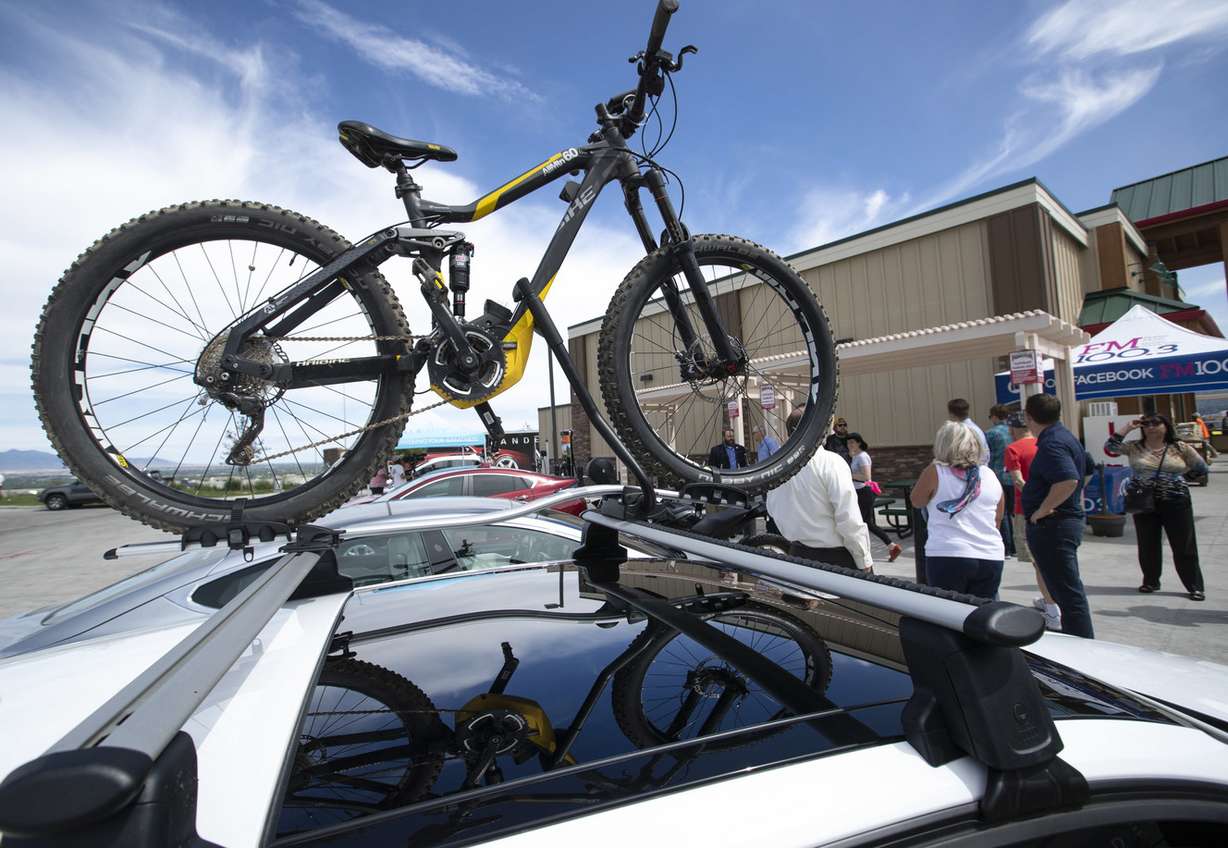 An electric mountain bike is attached to an electric vehicle at the Maverik at 14814 Minuteman Drive in Draper on Friday, June 29, 2018. Rocky Mountain Power and Maverik are celebrating the completion of the electric vehicle corridor along I-15 with the grand opening of several charging stations across the state. (Photo: Steve Griffin, KSL)