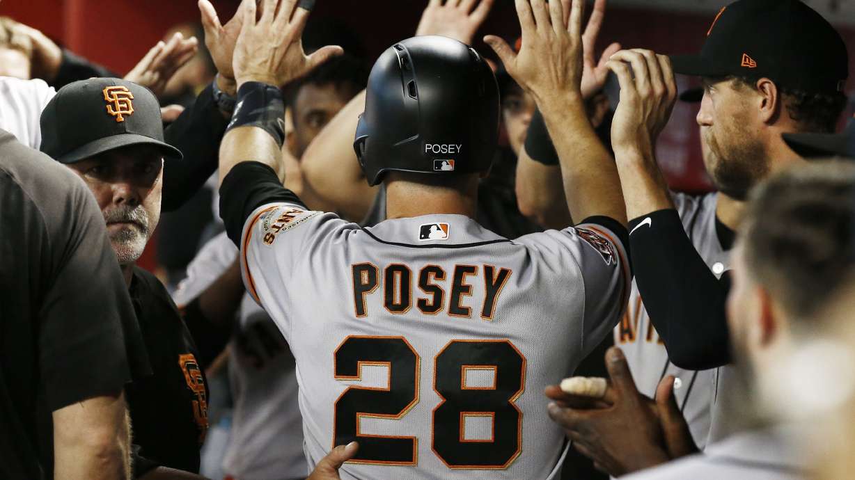 Rookies Suarez, Slater lead Giants past Diamondbacks 2-1