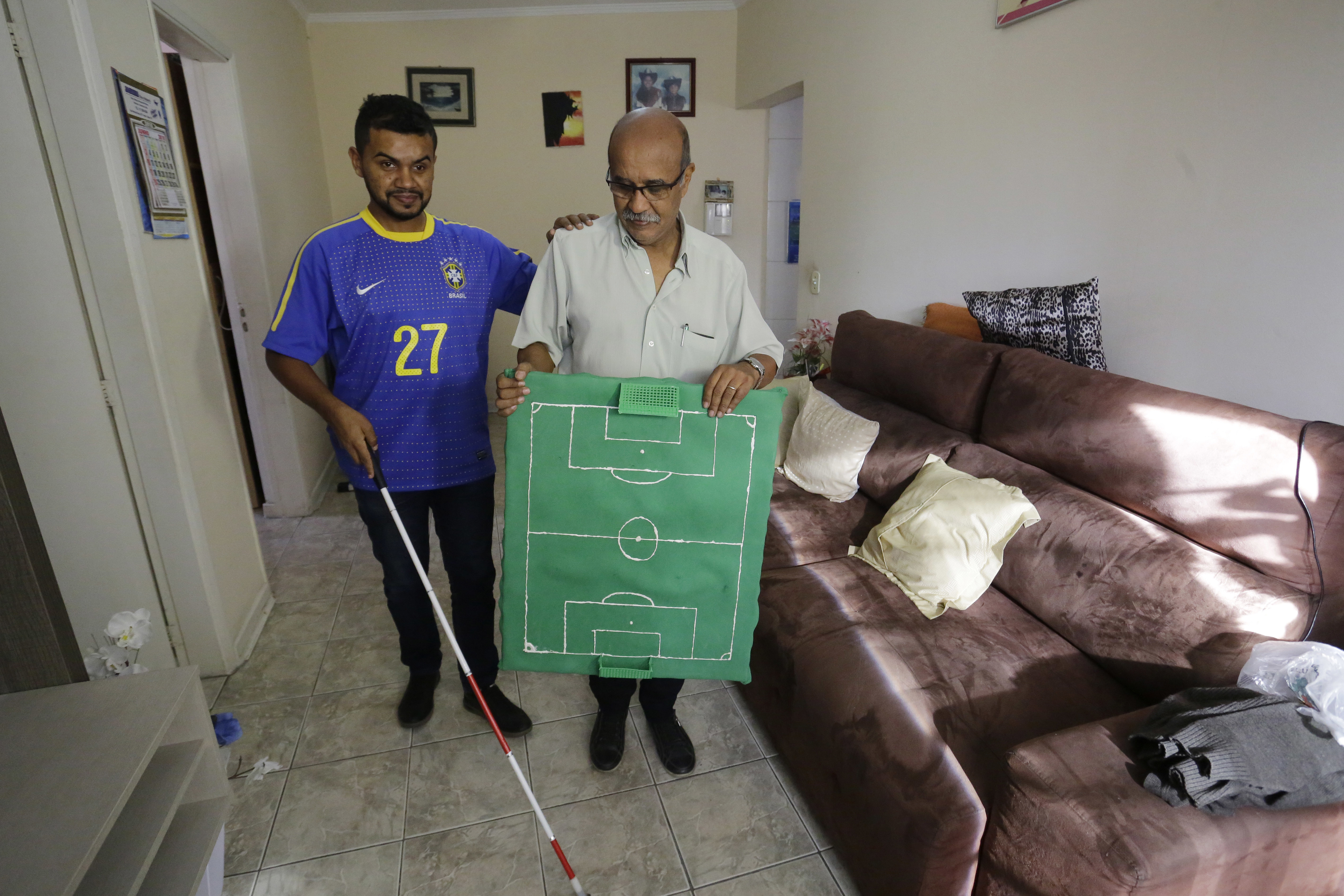 Brazil fan who is deaf, blind follows World Cup with help