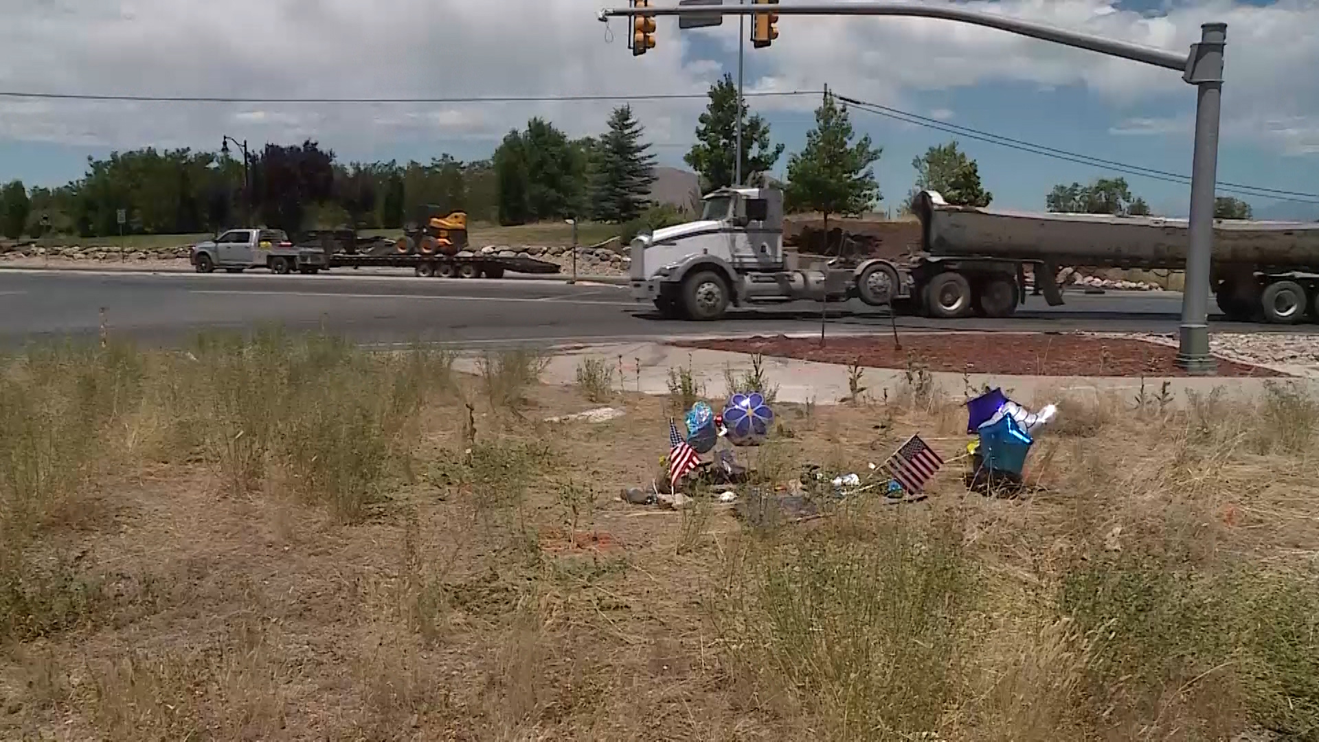 A makeshift memorial marks the spot where Rita Dolph's car was hit by a pickup truck that was fleeing from police on Saturday, June 30, 2018. The 17-year-old Payson resident died from her injuries the next day. (Photo: Meghan Thackrey, KSL TV)