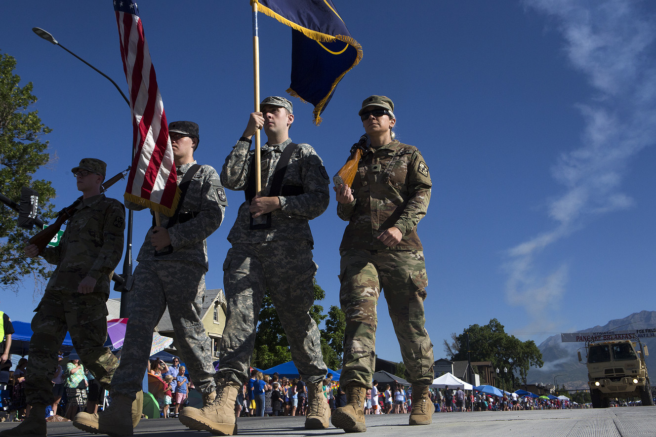Army soldiers march with the American and Utah flags during the America's Freedom Festival Grand Parade in Provo on Wednesday, July 4, 2018. (Photo: James Wooldridge, KSL)