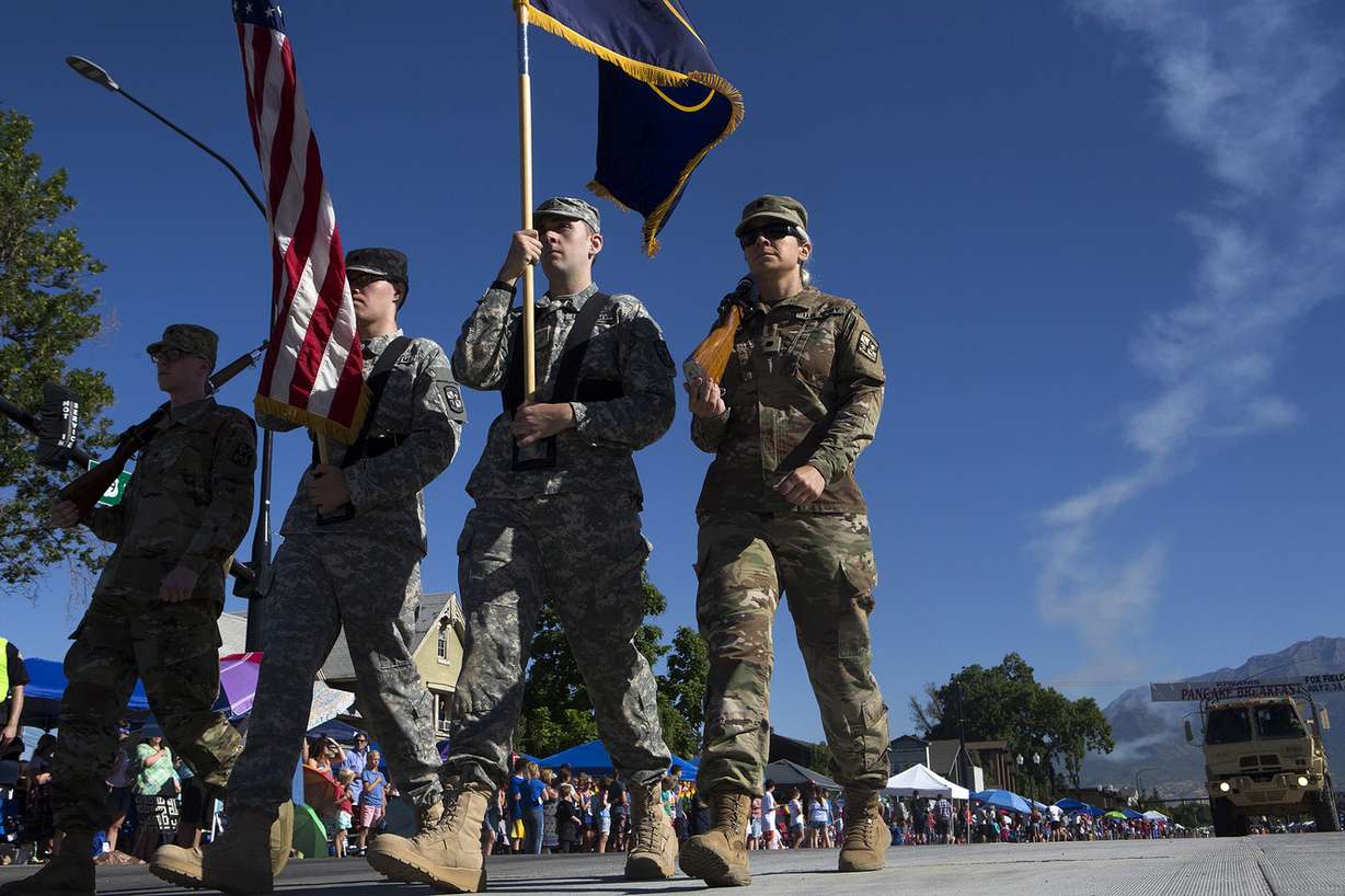Army soldiers march with the American and Utah flags during the America's Freedom Festival Grand Parade in Provo on Wednesday, July 4, 2018. (Photo: James Wooldridge, KSL)