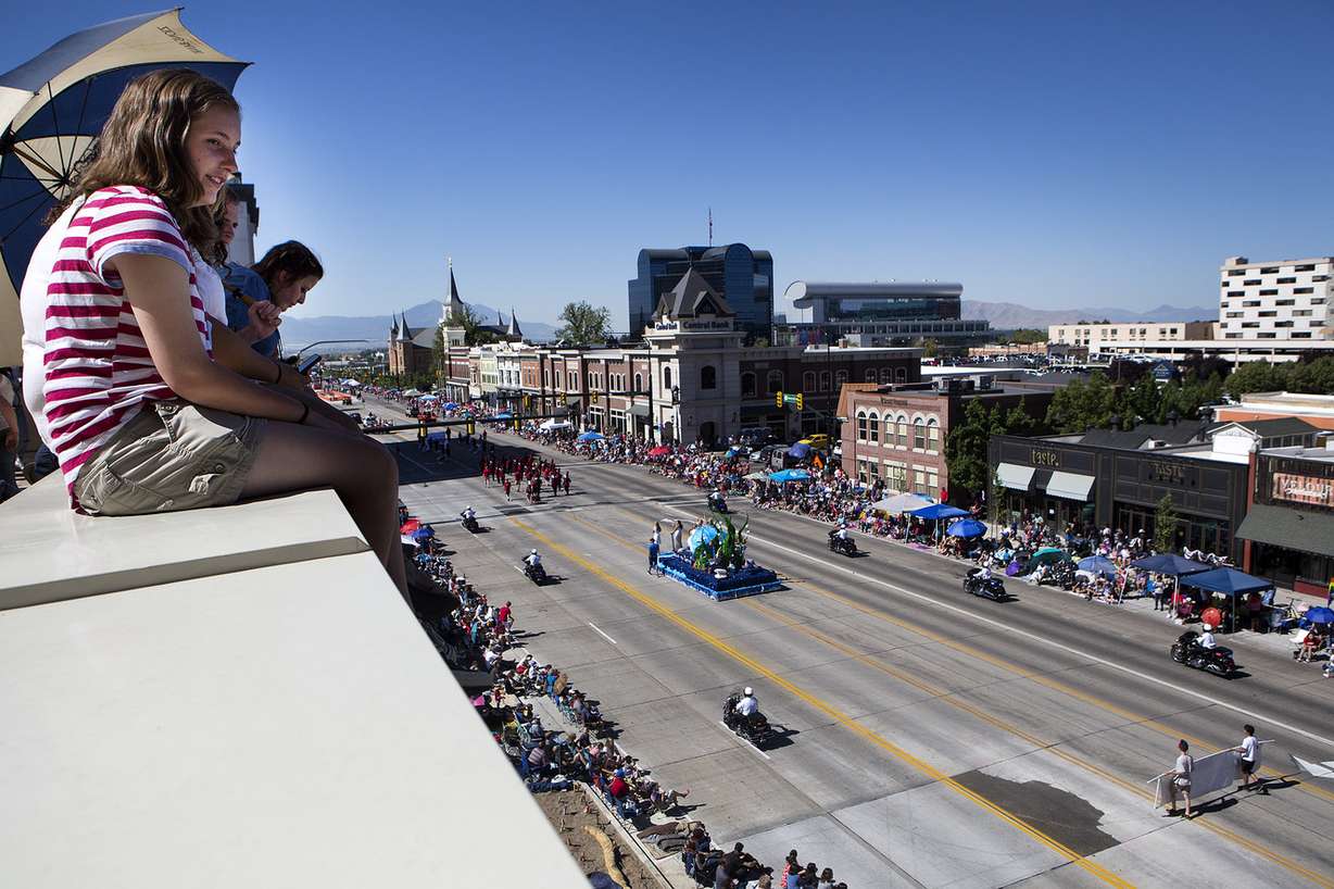 Emma Lopez, 17, watches the America's Freedom Festival Grand Parade from atop a wing of the Zions Bank Financial Center in Provo on Wednesday, July 4, 2018. (Photo: James Wooldridge, KSL)