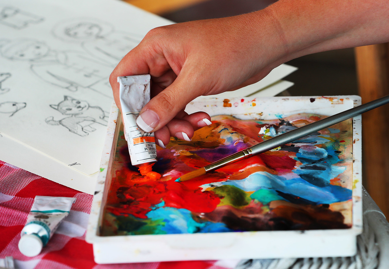 Amelia Murdock, who has created a series of phonics books and has started selling them online, shows some of the colors she uses in her books at her West Mountain home near Payson on Monday, May 21, 2018. (Photo: Scott G Winterton, Deseret News)