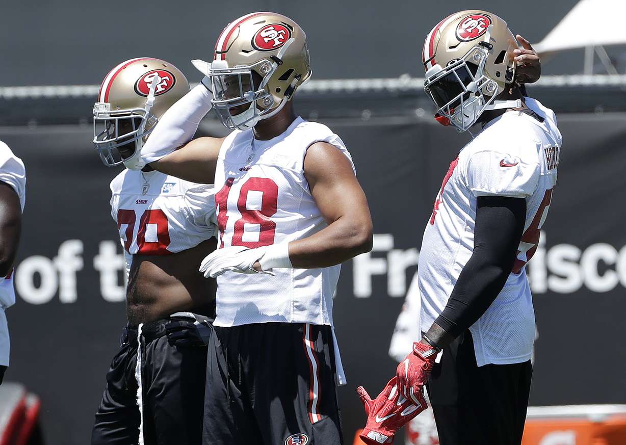 San Francisco 49ers linebacker Fred Warner, center, stands with teammates during NFL football practice at the team's headquarters in Santa Clara, Calif., Wednesday, June 13, 2018. (Photo: Jeff Chiu, AP Photo)