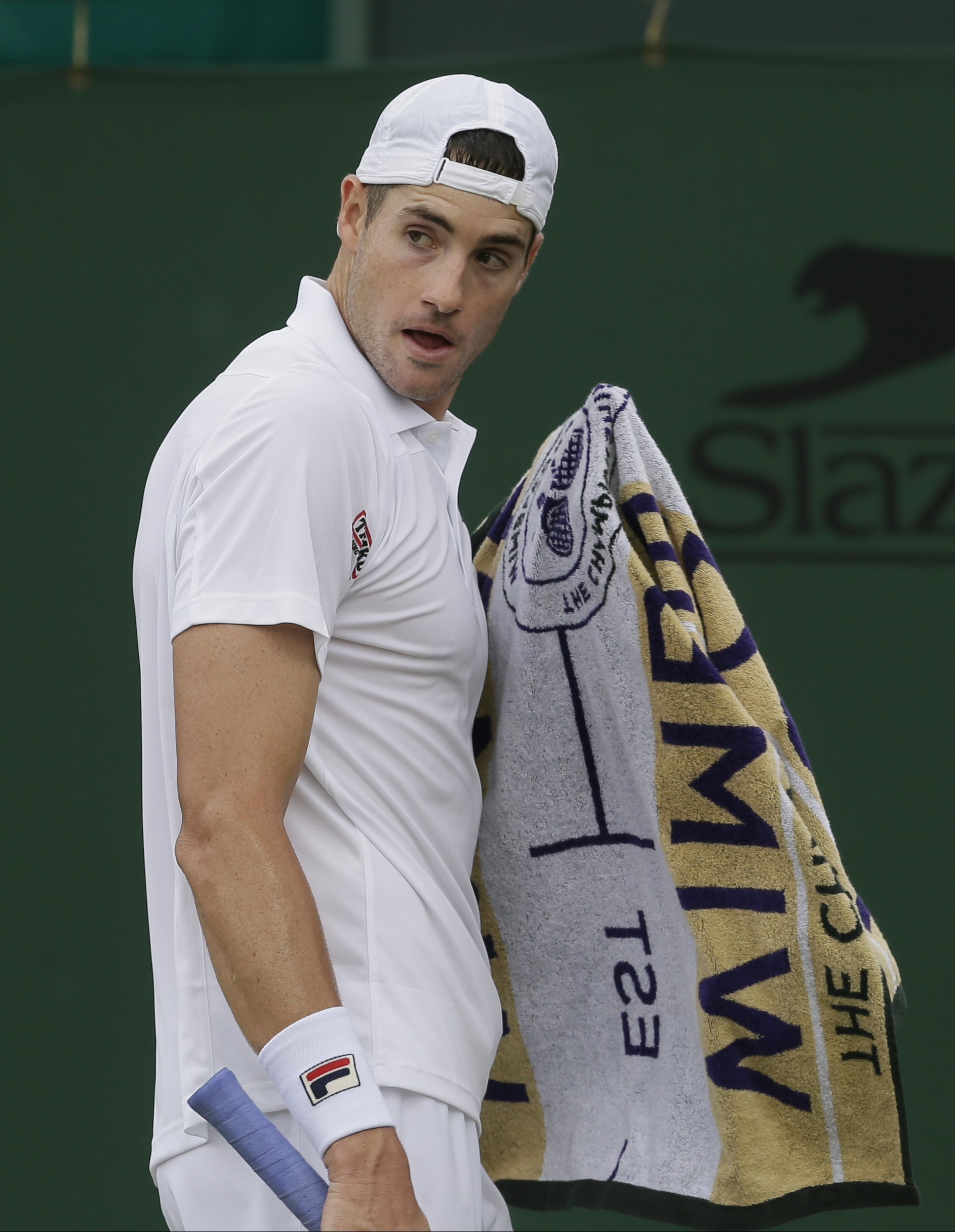 Isner hits 64 aces, saves 2 match points, in Wimbledon win