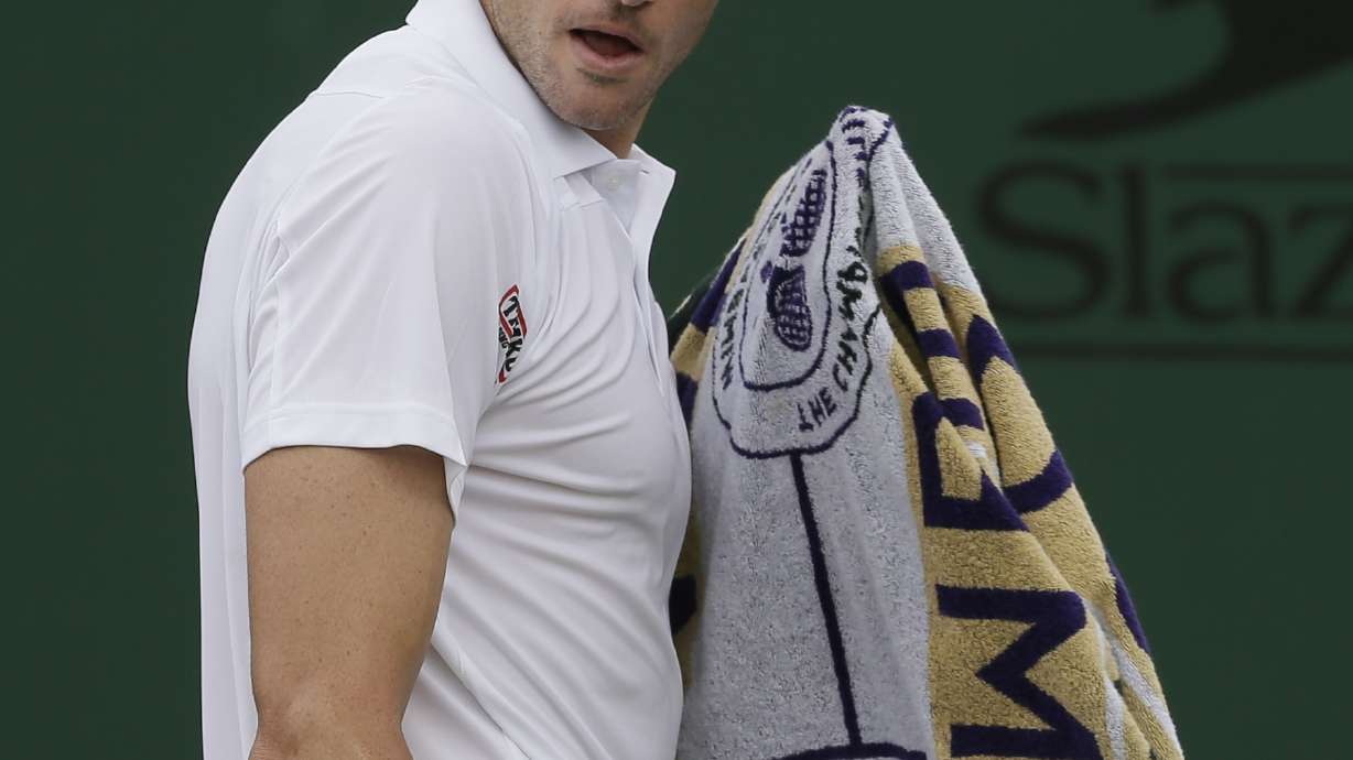 Isner hits 64 aces, saves 2 match points, in Wimbledon win