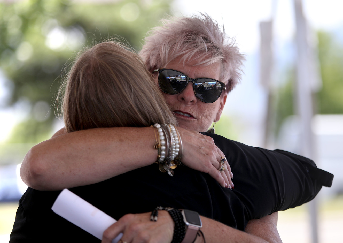 Cherryl Beveridge, UTA special services general manager, gets a hug from a former paratransit operator at a 30th anniversary celebration of paratransit's inception within the agency at the Riverside/Paratransit headquarters in South Salt Lake on Thursday, July 5, 2018. (Photo: Kristin Murphy, KSL)