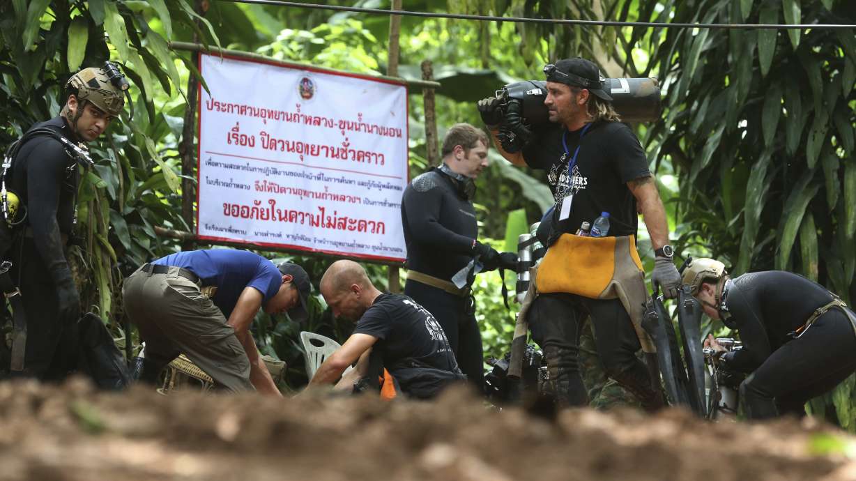 The Latest: Croatia World Cup squad offers Thai boys support