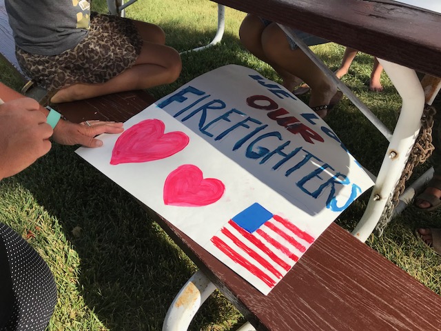 Dayna Porter and her children write notes for firefighters in Duchesne County Thursday, July 5, 2018. Her husband, Jason Porter, is currently fighting the Trail Mountain Fire in Emery County. Photo: KSL TV