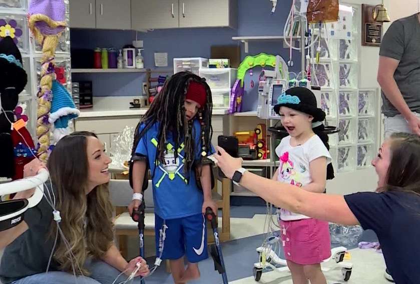 Cancer patient Hazel Crowfoot, age 5, reacts to seeing herself for the first time in a Princess Jasmine wig. (Photo: KSL TV)