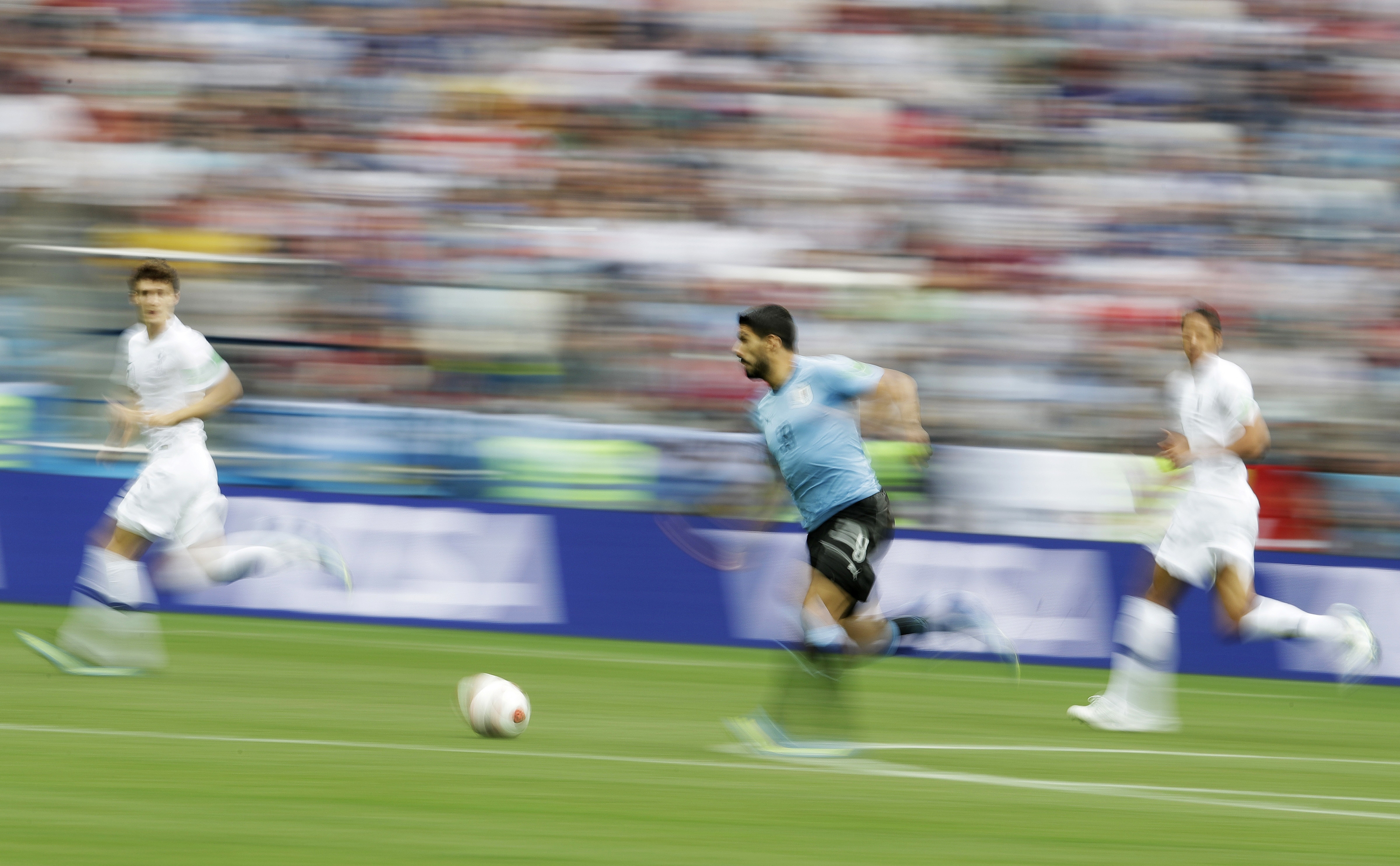 AP PHOTOS: Defenses crack, last of World Cup's giants falls