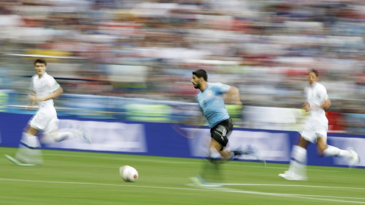 AP PHOTOS: Defenses crack, last of World Cup's giants falls