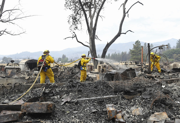 Lake Forest volunteer firefighters from left, Kyle Potter, Dylan Beck and Jerod Ellis work on putting out hot spots in an area burned down by the Klamathon Fire Friday in Hornbrook, Calif. California officials say they are temporarily closing a hatchery and two other public areas because of their proximity to a deadly blaze near the Oregon state line. The California Department of Fish and Wildlife says the Iron Gate Fish Hatchery along the Klamath River, the Klamathon Road fishing access below the hatchery and the Horseshoe Ranch Wildlife Area have been closed as a precaution. (Greg Barnette/The Record Searchlight/USA TODAY Network via AP)