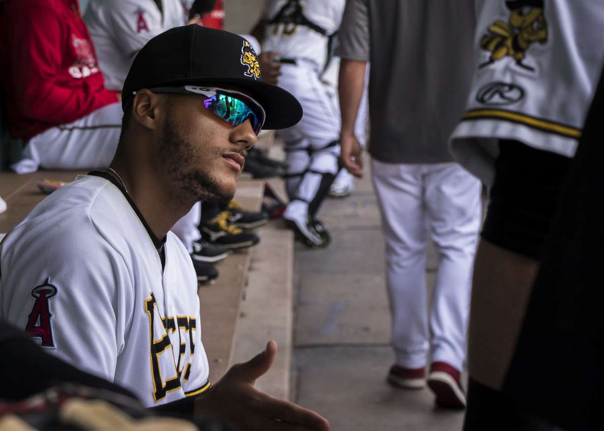 Salt Lake Bees outfielder Michael Hermosillo slaps hands with teammates before a game between the Bees and El Paso Chihuahuas at Smith's Ballpark on Saturday, July 7, 2018. Hermosillo has worn a new jersey number each stint he's spent in Salt Lake because he previous number has always been taken by the time he returns from his 3 major league call-ups this season. (Photo: Carter Williams, KSL.com)