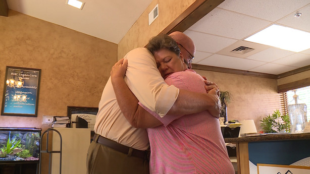 Monte Lucherini and Kathy Price hug after seeing each other for the first time Monday, July 10, 2018. Lucherini thanked Price for pulling his mother from a burning bed inside a skilled nursing facility in Logan just a few days before. (Photo: Mike Anderson, KSL TV)