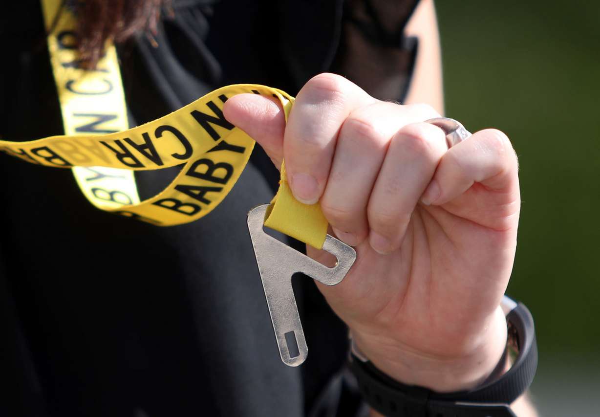 Jessica Strong, community health manager at Primary Children's Hospital, talks about Baby Safety Snaps, a safety device that helps prevent heat-related child injuries and deaths inside vehicles, during a press conference outside the hospital's Outpatient Services Building in Salt Lake City on Tuesday, July 10, 2018. (Photo: Kristin Murphy, KSL)