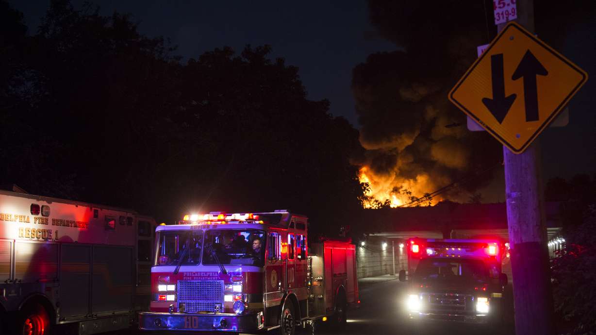 Philadelphia junkyard fire spews thick smoke, flames