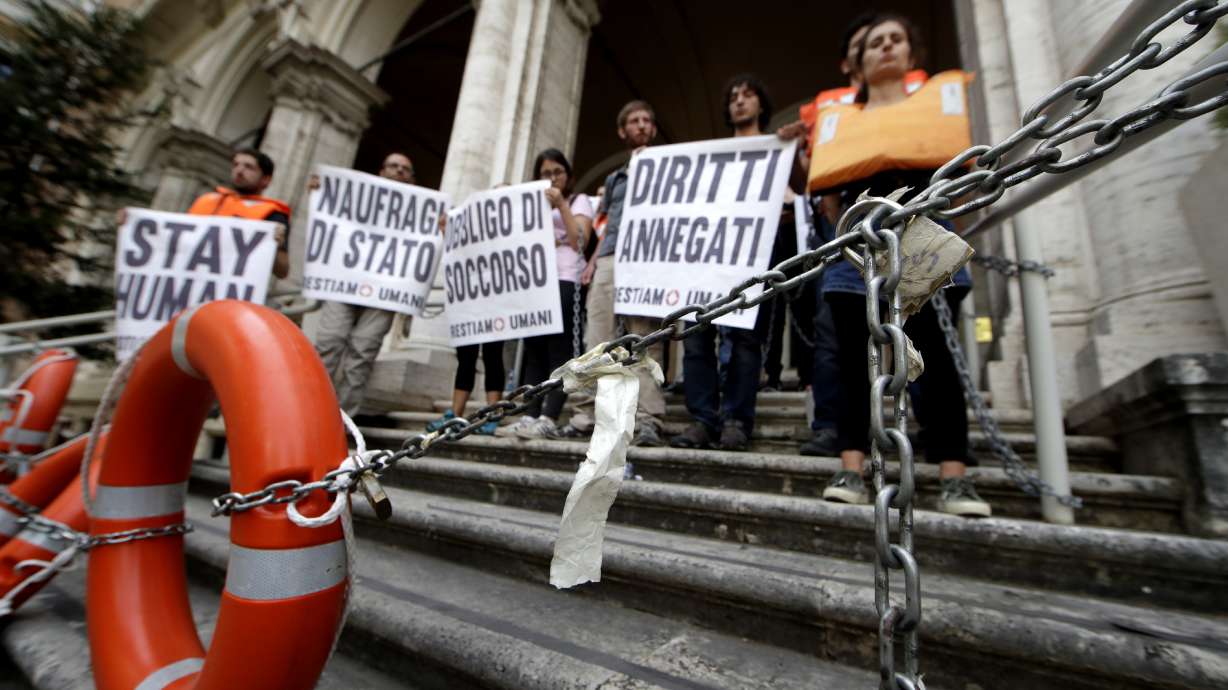 The Latest: Malta lets rescue ship captain visit elderly mom