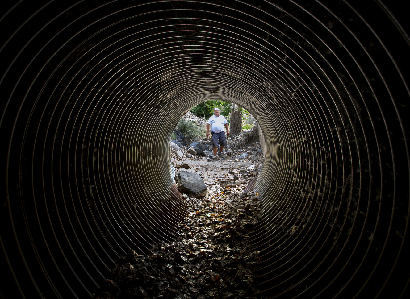 Scott Parsell, general manager of Benchmark Water District in Farmington, walks down the dry creek bed of Davis Creek that feeds the city's irrigation water reservoir C in the foothills of Farmington on Wednesday, July 11, 2018. The city's irrigation water system is in dire condition facing a severe water shortage. (Photo: Steve Griffin, KSL)