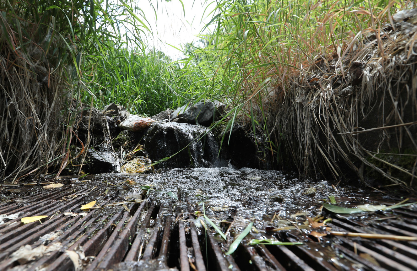 The last of the water flowing down Davis Creek drains into a grate that feeds the city's irrigation water reservoir C in the foothills of Farmington on Wednesday, July 11, 2018. The city's irrigation water system is in dire condition facing a severe water shortage. (Photo: Steve Griffin, KSL)