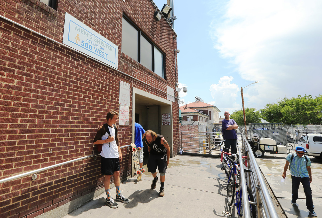 Men stand outside the men's entrance at the Road Home in Salt Lake City on Wednesday, July 11, 2018. The shelter has created a new security screening area in the men's section. (Photo: Scott G Winterton, KSL)