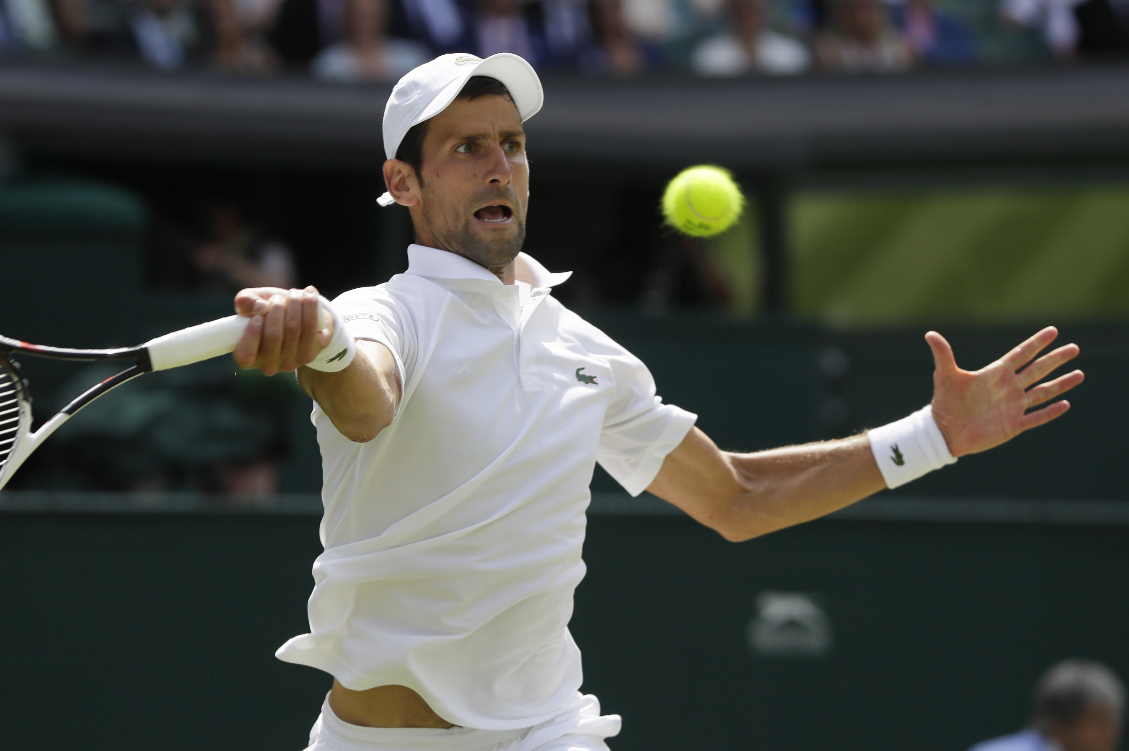 The Latest: Isner wins 3rd set of Wimbledon semi vs Anderson