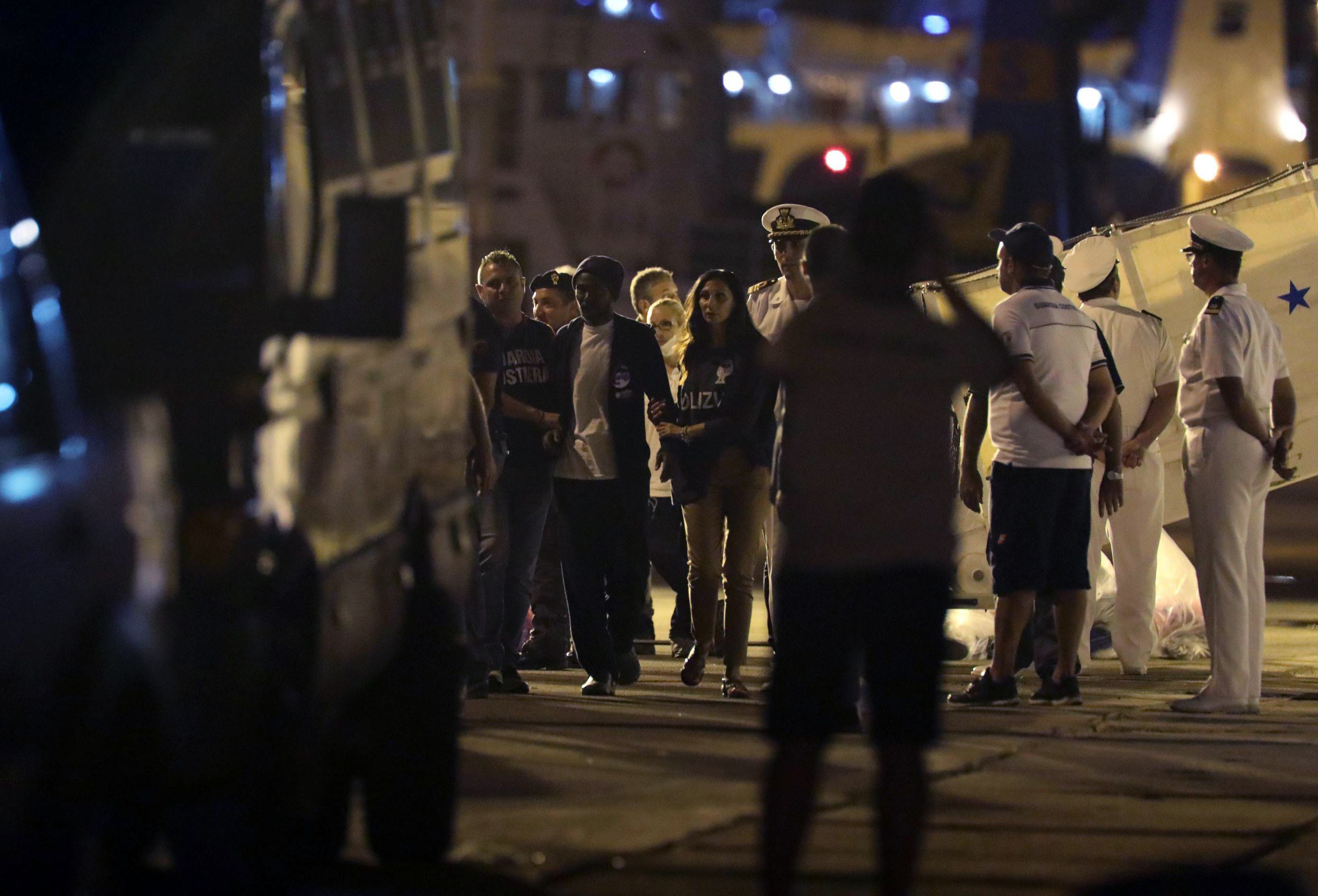 The Latest: Italy, Malta at odds over boat with 450 migrants