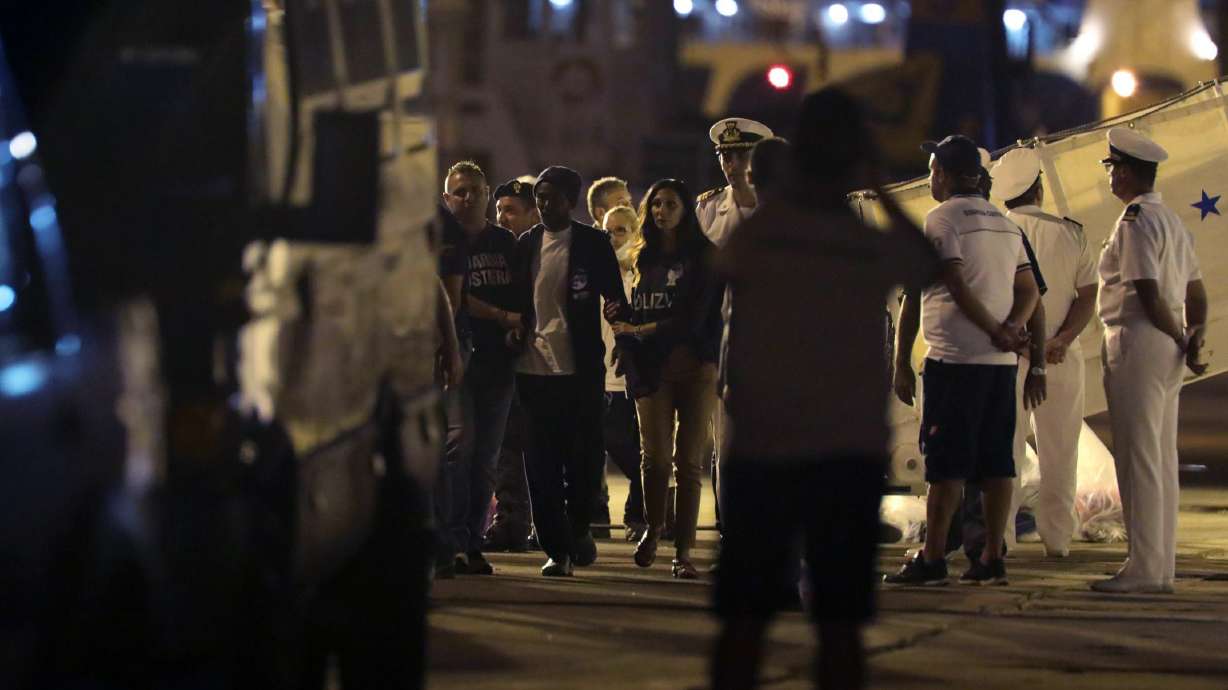 The Latest: Italy, Malta at odds over boat with 450 migrants