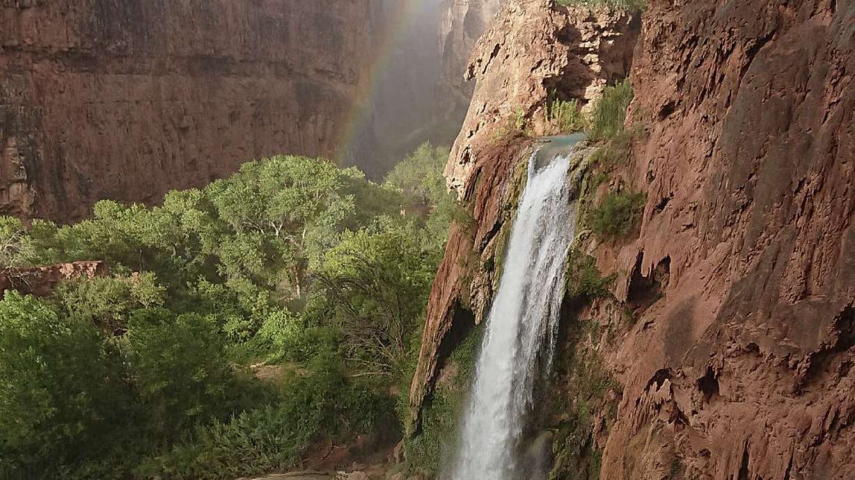 The Latest: Floods force hundreds to reschedule camping trip