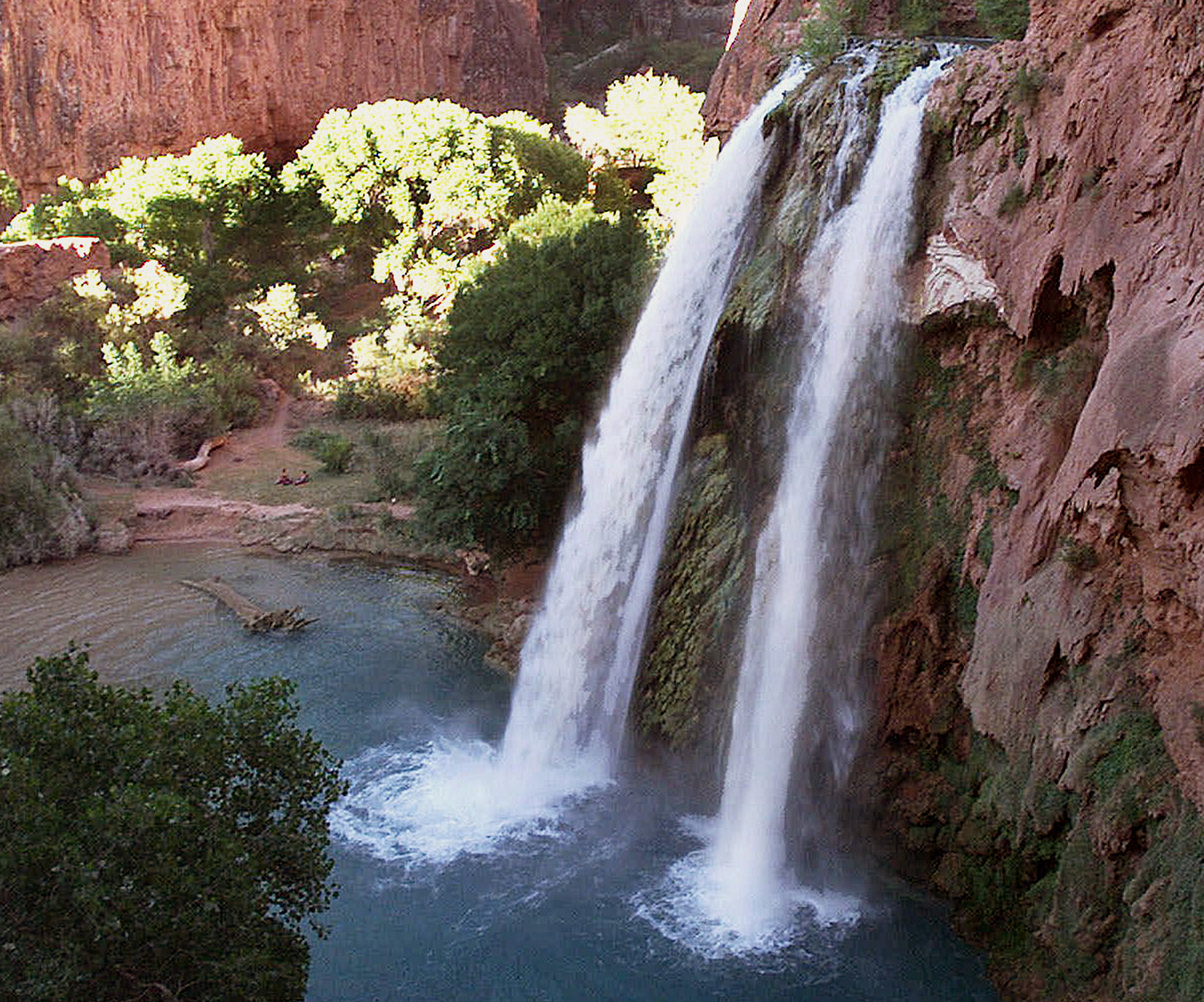 One of five waterfalls on Havasu Creek on the Havasupai Tribe's reservation in a southeastern branch of the Grand Canyon near Supai, Ariz. Park rangers say the body of an Arizona woman who went missing in the Grand Canyon National Park after a flash flood days earlier has been recovered.