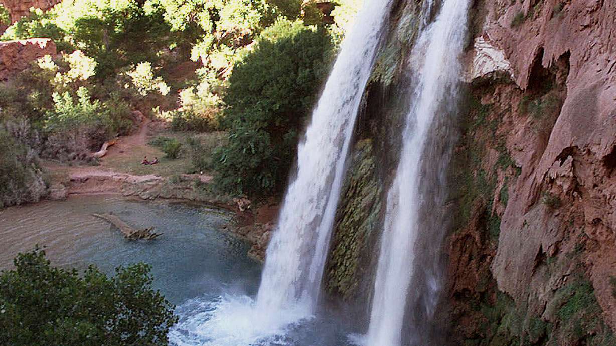 One of five waterfalls on Havasu Creek on the Havasupai Tribe's reservation in a southeastern branch of the Grand Canyon near Supai, Ariz. Park rangers say the body of an Arizona woman who went missing in the Grand Canyon National Park after a flash flood days earlier has been recovered.