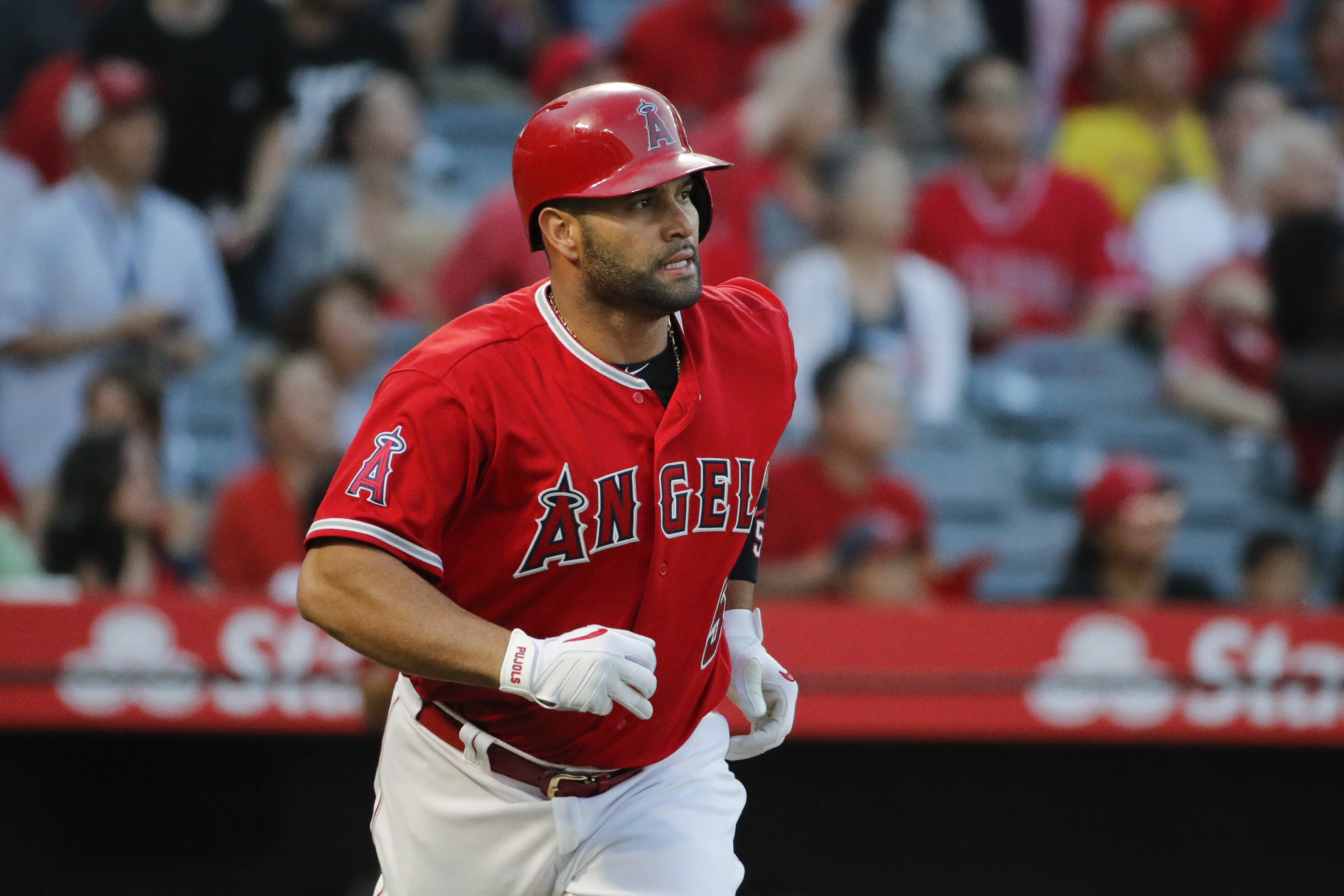 Angels' Pujols has injection in knee, goes on DL