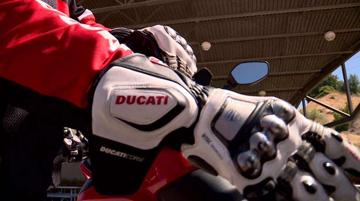 Ryan Stanley puts on his riding gloves. Even when it’s hot in the summer, he dresses in all his gear because he said it could be life-saving. (Photo: KSL TV)