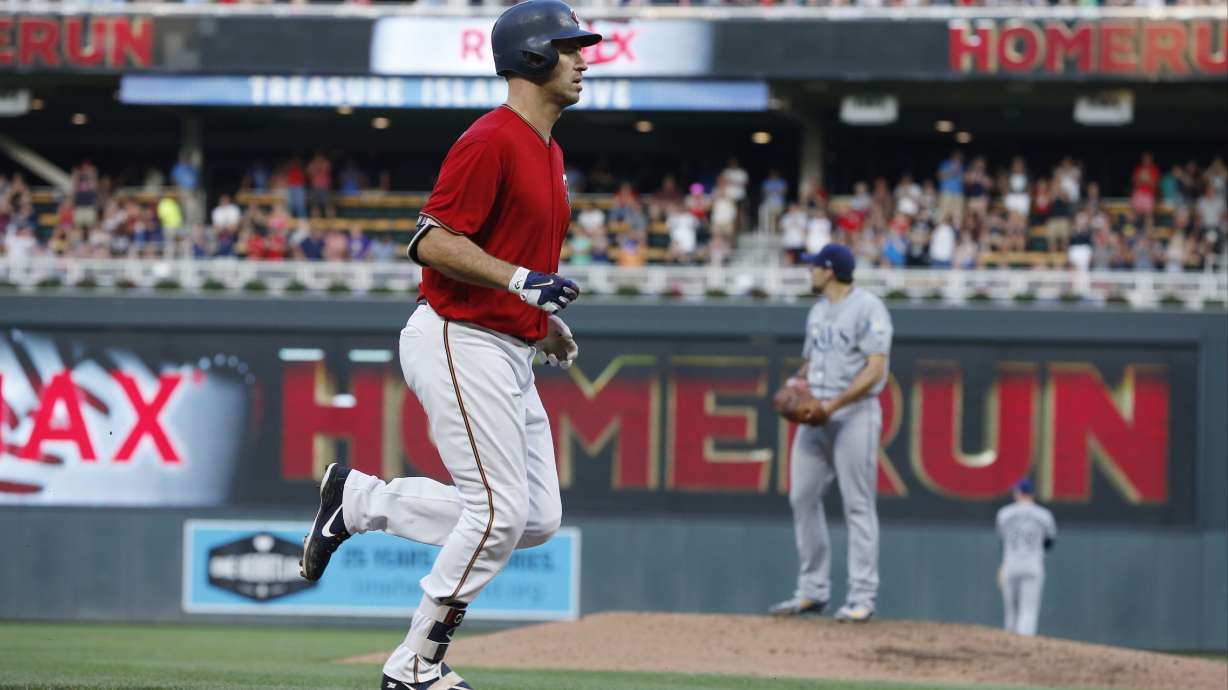Mauer homers, drives in four as Twins outlast Rays 11-8