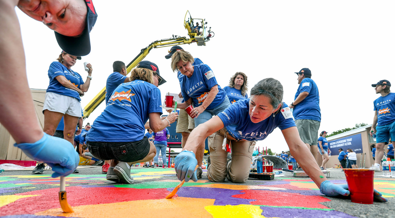 Delta flight attendant Loretta Martinez, of Park City, works with other volunteers from Delta Air Lines, Utah Community Action and the community in transforming an empty site into a kid-designed, state-of-the-art playground at James R. Russell Head Start in Salt Lake City on Saturday, July 14, 2018. (Photo: Steve Griffin, KSL)