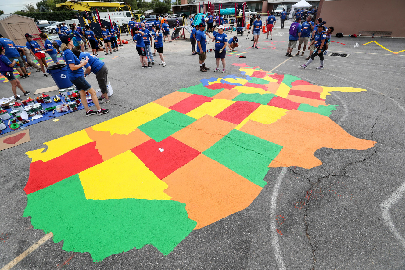 Volunteers from Delta Air Lines, Utah Community Action and the community join KaBOOM! in transforming an empty site into a kid-designed, state-of-the-art playground at James R. Russell Head Start in Salt Lake City on Saturday, July 14, 2018. The new playground, which was constructed in six hours, will serve more than 200 kids per day with high-quality early childhood education. (Photo: Steve Griffin, KSL)