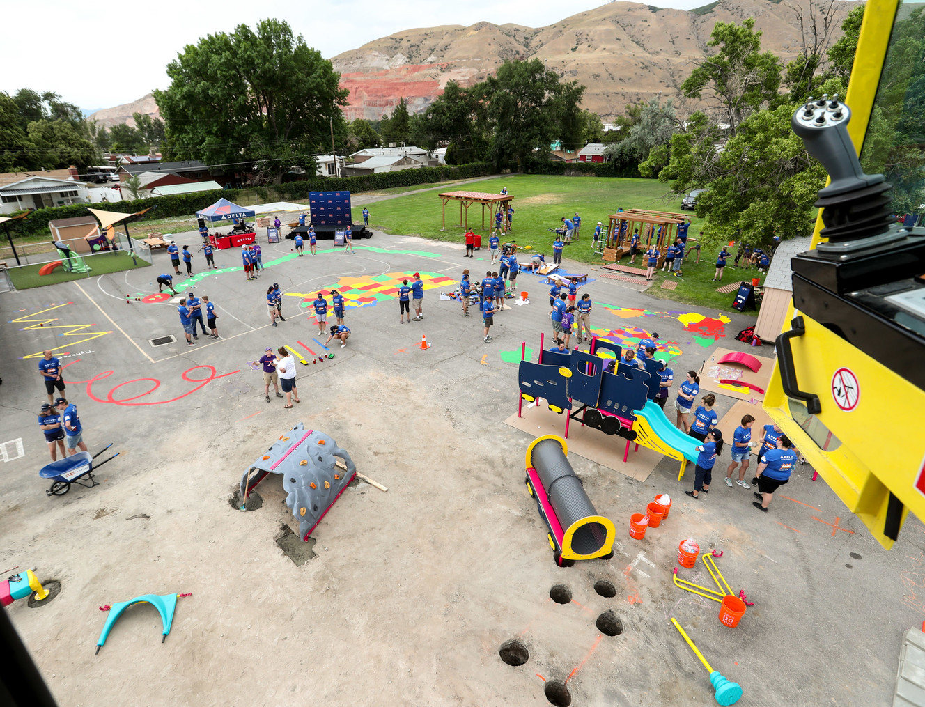 Volunteers from Delta Air Lines, Utah Community Action and the community join KaBOOM! in transforming an empty site into a kid-designed, state-of-the-art playground at James R. Russell Head Start in Salt Lake City on Saturday, July 14, 2018. The new playground, which was constructed in six hours, will serve more than 200 kids per day with high-quality early childhood education. (Photo: Steve Griffin, KSL)