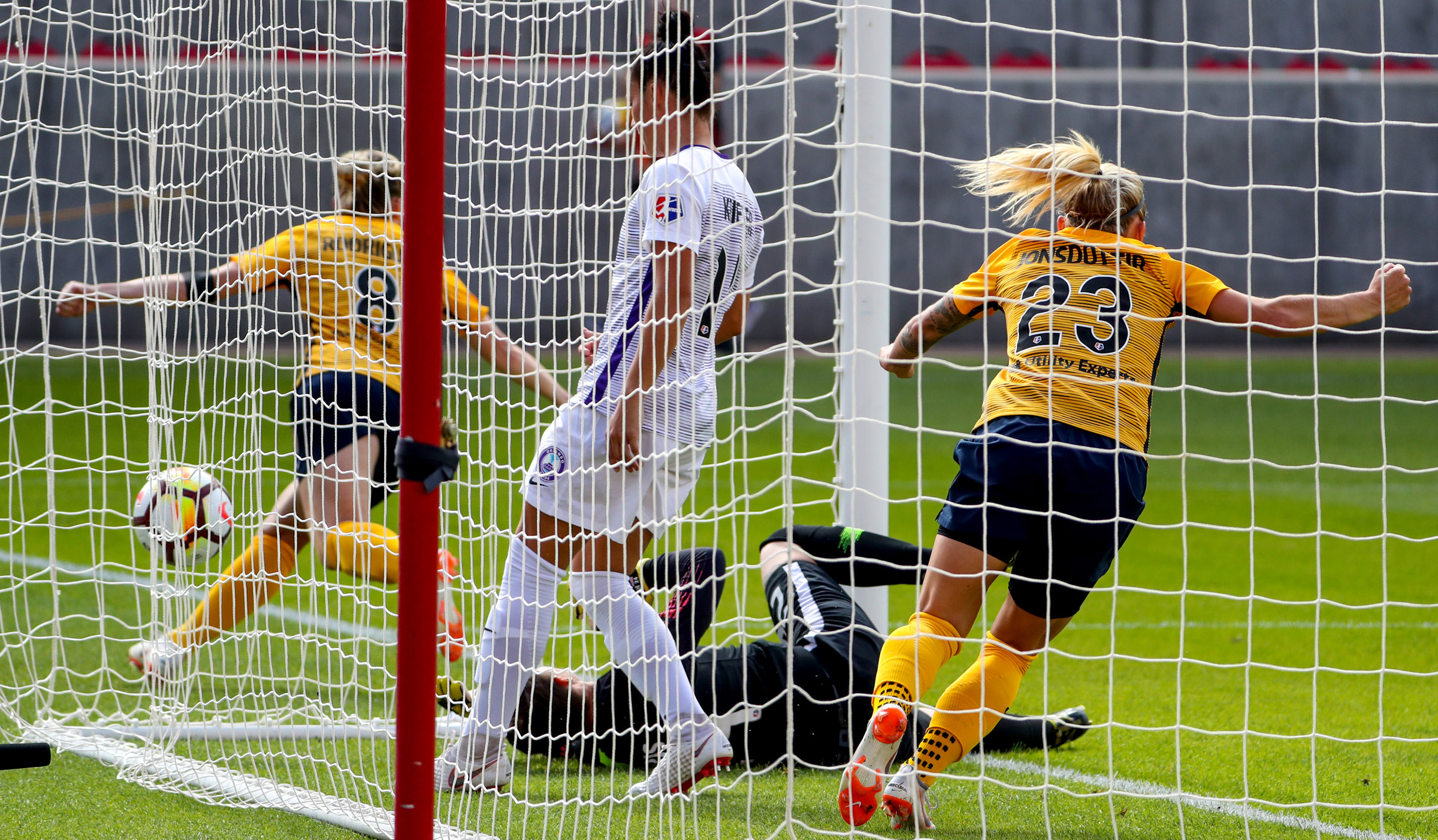 Utah Royals FC forward Amy Rodriguez (8),left and Utah Royals FC midfielder Gunny Jónsdóttir (23), right, race away from the goal after Rodriguez chipped a shot over the head of Orlando Pride goalkeeper Ashlyn Harris (24) for a goal during soccer match against the Orlando Pride at Rio Tinto Stadium in Sandy on Saturday, July 14, 2018. (Photo: Steve Griffin, Deseret News)