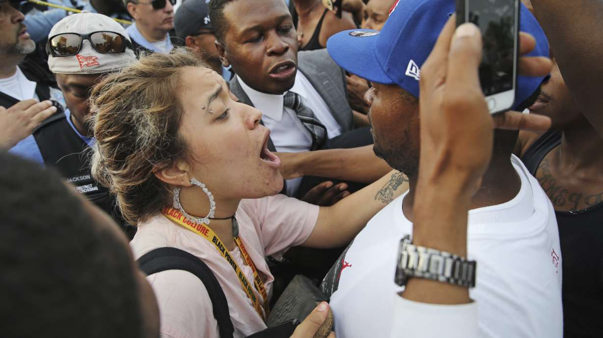 The Latest: Video: Chicago man ran away, reached to waist