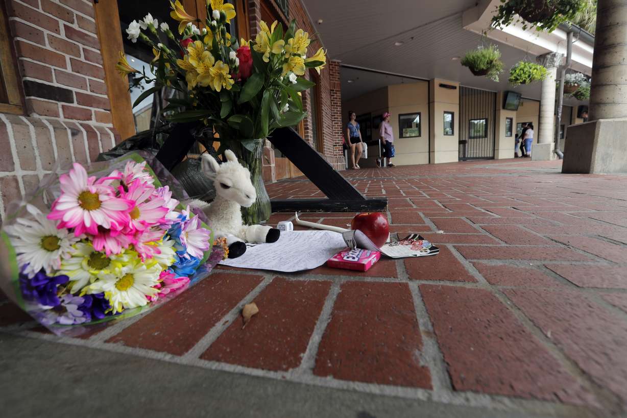 A makeshift memorial is seen outside the Audubon Zoo in New Orleans, Monday, July 16, 2018. The death of a wounded fox brings to nine the number of animals that have died as the result of the weekend escape of a jaguar from its enclosure at the zoo in New Orleans. Audubon Zoo officials say on the zoo's website that Rusty, one of two foxes attacked by the big cat, died Monday. (Gerald Herbert, AP Photo)