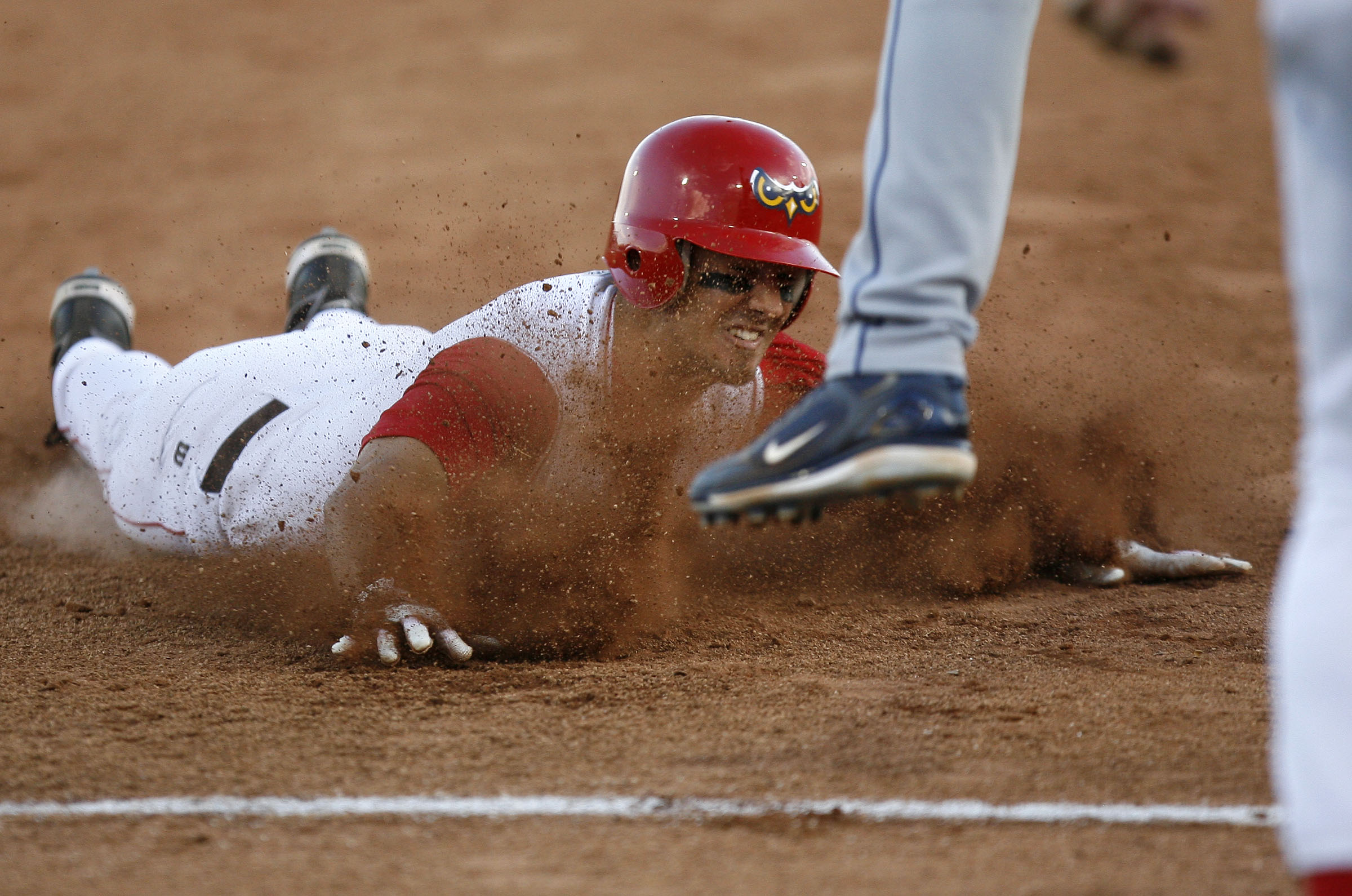 Orem Owlz' Gabe Jacobo slides safely into third base during Saturday night's game against the Ogden Raptors at Orem on June 21 , 2008. (Photo: Kristin Murphy, KSL, File)