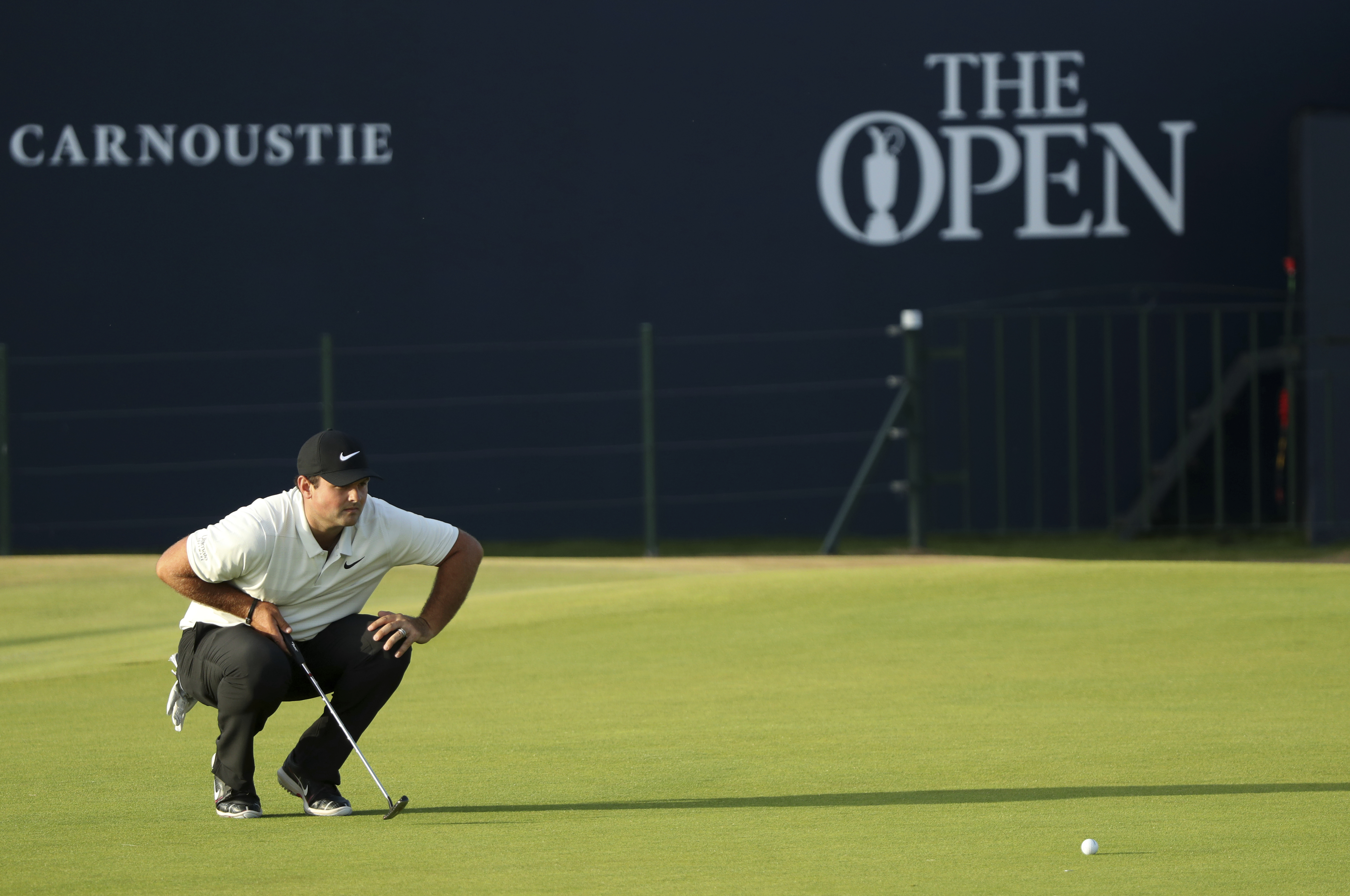 The Latest: Spieth, Schauffele, Kisner share lead at Open