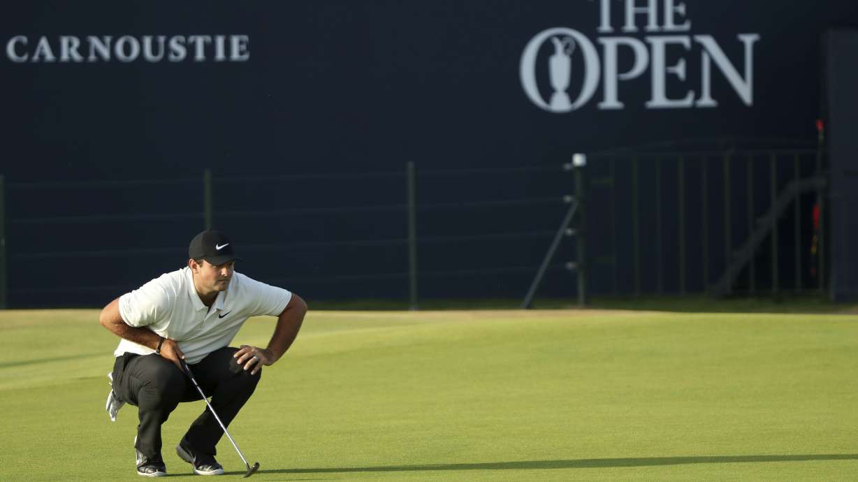 The Latest: Spieth, Schauffele, Kisner share lead at Open