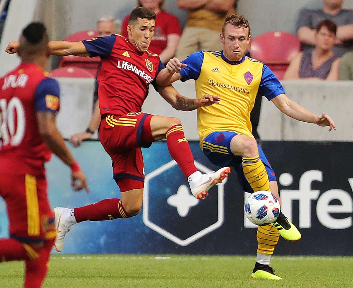 Real Salt Lake defender Aaron Herrera (22) and Colorado Rapids midfielder Jack McBean (32) battle for the ball as Real Salt Lake and the Colorado Rapids play at Rio Tinto Stadium in Sandy on Saturday, July 21, 2018. (Photo: Scott G Winterton, Deseret News)