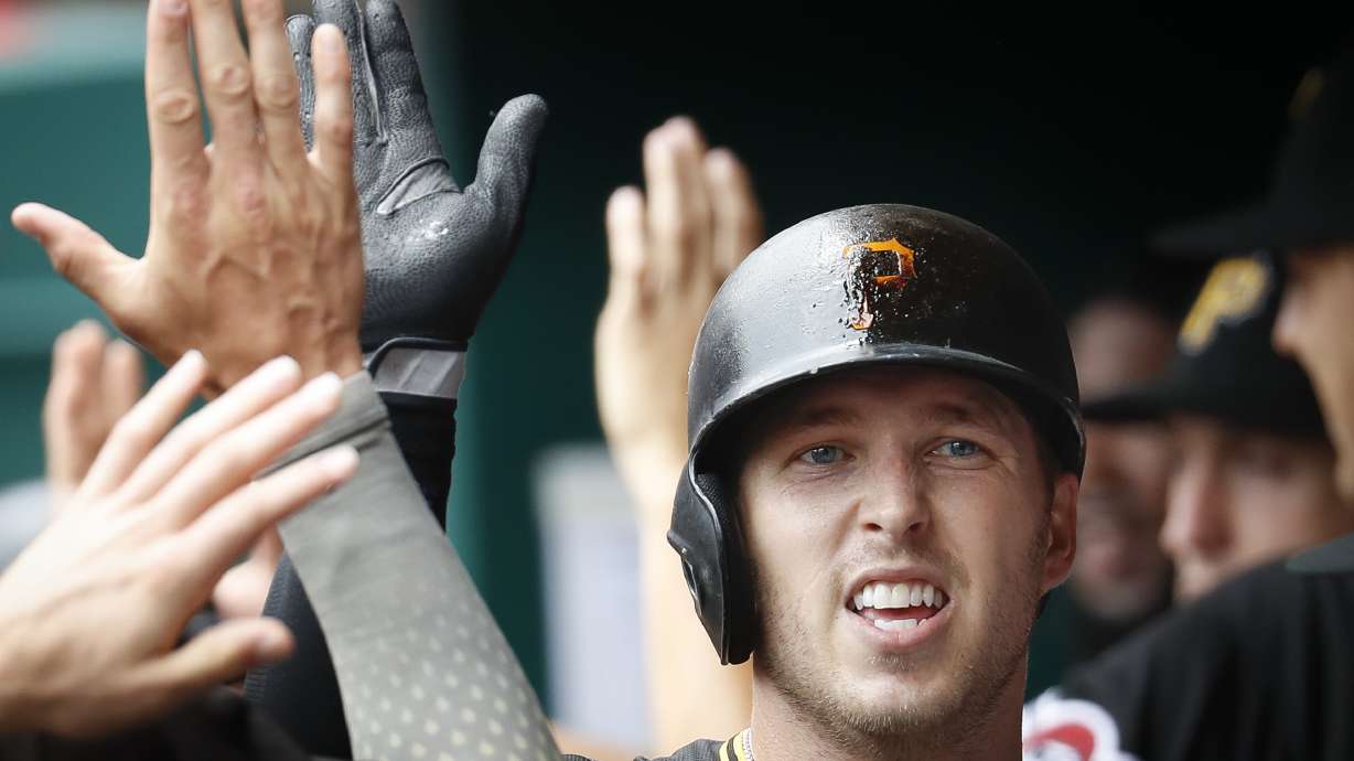 Dickerson homers again as Pirates sweep Reds with 9-2 win